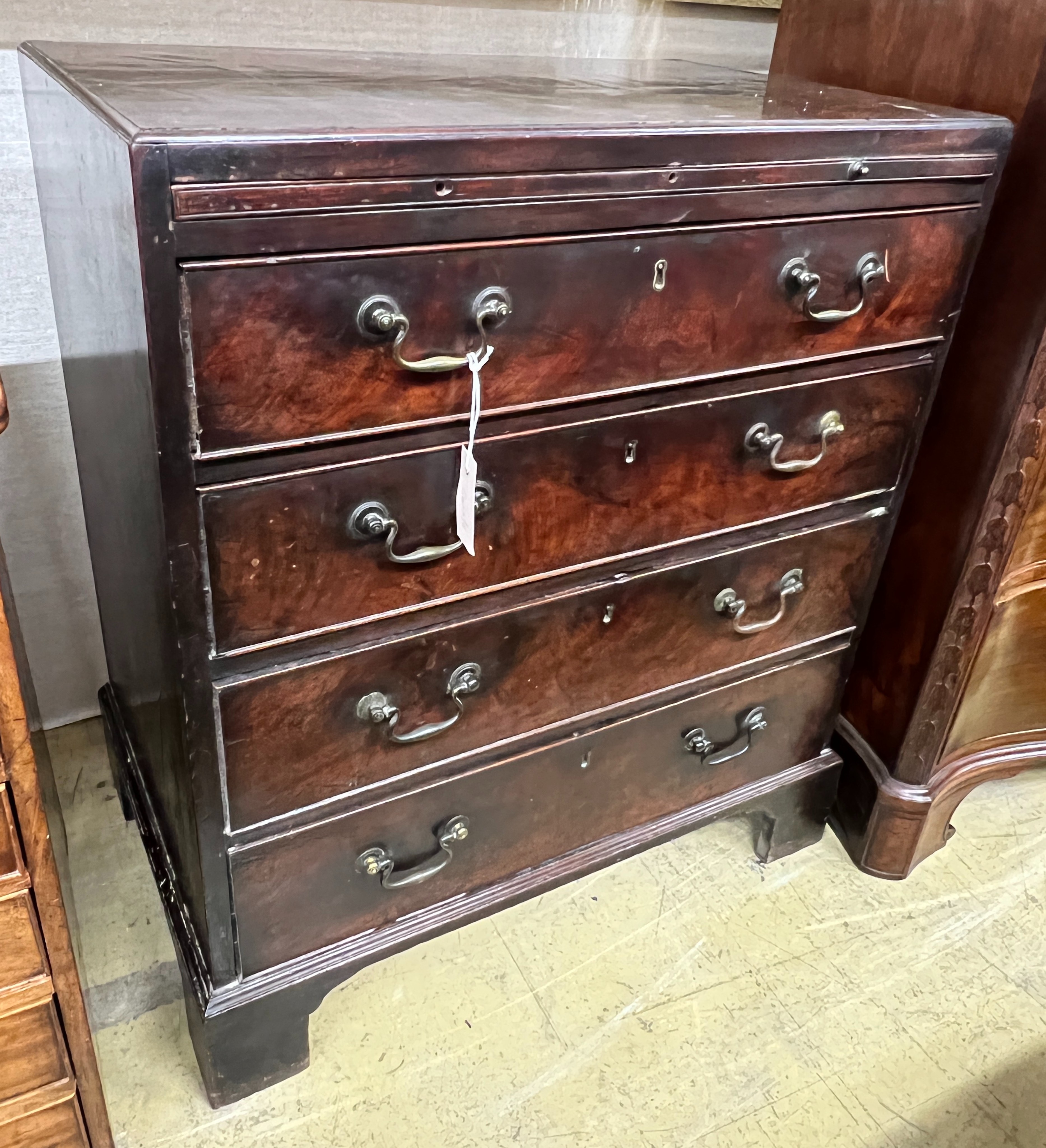 A small George III mahogany four drawer chest, fitted slide, width 71cm, depth 45cm, height 82cm